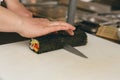 Close up of man japanese restaurant chef cooking sushi in the kitchen Royalty Free Stock Photo