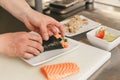 Close up of man japanese restaurant chef cooking sushi in the kitchen Royalty Free Stock Photo