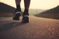 Close-up of a man legs running along the road. Running through dusty terrain with emphasis on the runner Royalty Free Stock Photo