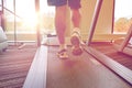 Close up of man legs walking on treadmill in gym Royalty Free Stock Photo