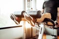 Close up of man lifting weight by two legs for stretching muscle at fitness gym at private condominium background. Sport and