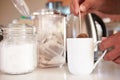 Close Up Of Man Making Tea In Cup Using Teabag Royalty Free Stock Photo