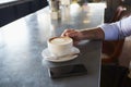 Close Up Of Man With Mobile Phone On Counter Of Coffee Shop Royalty Free Stock Photo