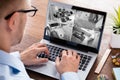 Man Monitoring The Video Footage On Laptop Royalty Free Stock Photo