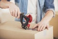 Close-up. Man packing boxes. Moving, purchase of new habitation Royalty Free Stock Photo