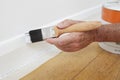 Close Up Of Man Painting Skirting Board Royalty Free Stock Photo