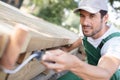 close-up man painting table outdoors