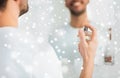 Close up of man perfuming with perfume at bathroom Royalty Free Stock Photo