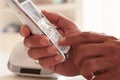 Close Up Of Man Picking Up Telephone Handset And Dialing