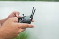 Man play mobile Drone by remote control joystick connect with smartphone Royalty Free Stock Photo