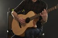 Close Up Of Man Playing Amplified Acoustic Guitar Royalty Free Stock Photo