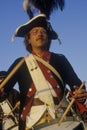 Close up of man playing drum during American Revolutionary war reenactment Royalty Free Stock Photo
