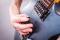 Close up of man playing on electric guitar Royalty Free Stock Photo