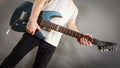 Close up of man playing on electric guitar Royalty Free Stock Photo