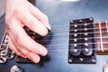 Close up of man playing on electric guitar Royalty Free Stock Photo