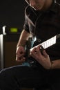 Close Up Of Man Playing Electric Guitar In Studio Royalty Free Stock Photo