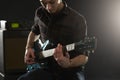 Close Up Of Man Playing Electric Guitar In Studio Royalty Free Stock Photo