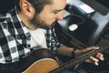 Close-up of a man playing Spanish guitar. Guitarist and musician Royalty Free Stock Photo