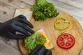 man preparing sandwiches