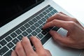 man pressing the enter key on his laptop. close up. Royalty Free Stock Photo