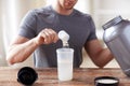 Close up of man with protein shake bottle and jar Royalty Free Stock Photo