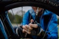 Close-up of a man pumping bicycle wheel in nature. Royalty Free Stock Photo