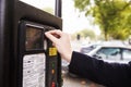 Close Up Of Man Putting Money In Parking Meter For Ticket Royalty Free Stock Photo