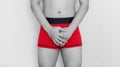 Close-up a man in red underwear. Men health, and sexual dysfunction problems Royalty Free Stock Photo
