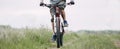 Close up of man riding bicycle along country road Royalty Free Stock Photo