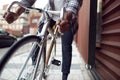 Close Up Of Man Riding Sustainable Bamboo Bicycle On City Street