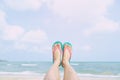 Close Up of a man`s bare feet stand at wet on the beach Royalty Free Stock Photo