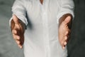 Close up of man`s cupped hands show something on white background. Palms up. High resolution product Royalty Free Stock Photo