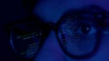 Close up of man's face with binary code reflection on glasses Royalty Free Stock Photo
