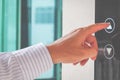 Close-up Of A Man`s Finger Pressing On Open Elevator Button