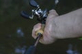 Close-up of a man`s hand with bait casting rods Royalty Free Stock Photo