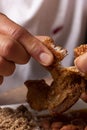 Close-up of man`s hand eating fried pork rinds. Colombian traditional food Royalty Free Stock Photo