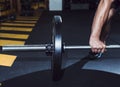 close up man s hand lifting barbell. High quality photo Royalty Free Stock Photo