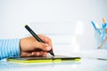 Close-up of a man's hand with a pen stylus Royalty Free Stock Photo