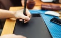 Close-up of a man's hand with a pen stylus Royalty Free Stock Photo