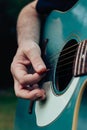 Close up of man\'s hand playing acoustic guitar. Concept of musical instrument Royalty Free Stock Photo