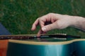 Close up of man\'s hand playing acoustic guitar. Musical instrument concept Royalty Free Stock Photo