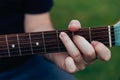 Close up of man\'s hand playing acoustic guitar. Concept of music Royalty Free Stock Photo