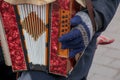 Close-up of a man's hand playing button accordion outdoors in winter Royalty Free Stock Photo