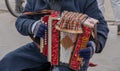 Close-up of a man's hand playing button accordion outdoors in winter Royalty Free Stock Photo