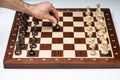 Close-up Of Man`s Hand Playing The Chess Game Board Royalty Free Stock Photo