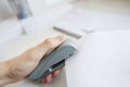Close-up of man's hand stapling paper in office Royalty Free Stock Photo