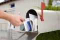 Close-up Of Man`s Hand Taking Letter From Mailbox Royalty Free Stock Photo