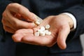 Close up of man`s hand taking out pills from blister pack Royalty Free Stock Photo