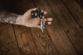 Close up of a man`s hand with tattoo gun