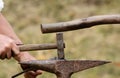 Close-up of man`s hand using a rustic hammer Royalty Free Stock Photo